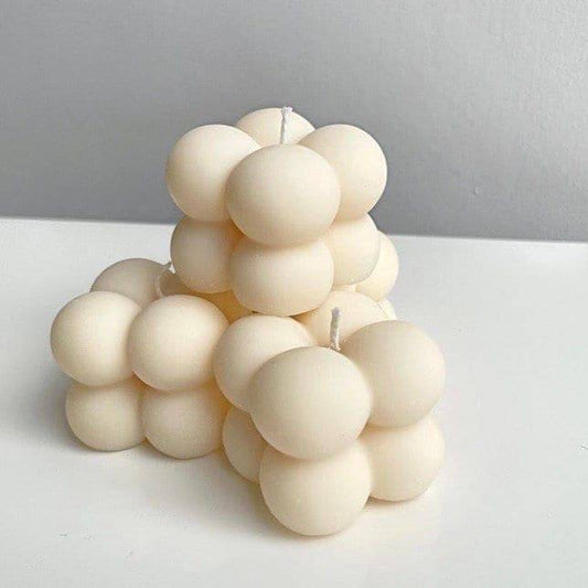 Small Bubble Candle with a modern geometric design, perfect for home decor. Aesthetic white wax candle ideal for nature-inspired outdoor displays.